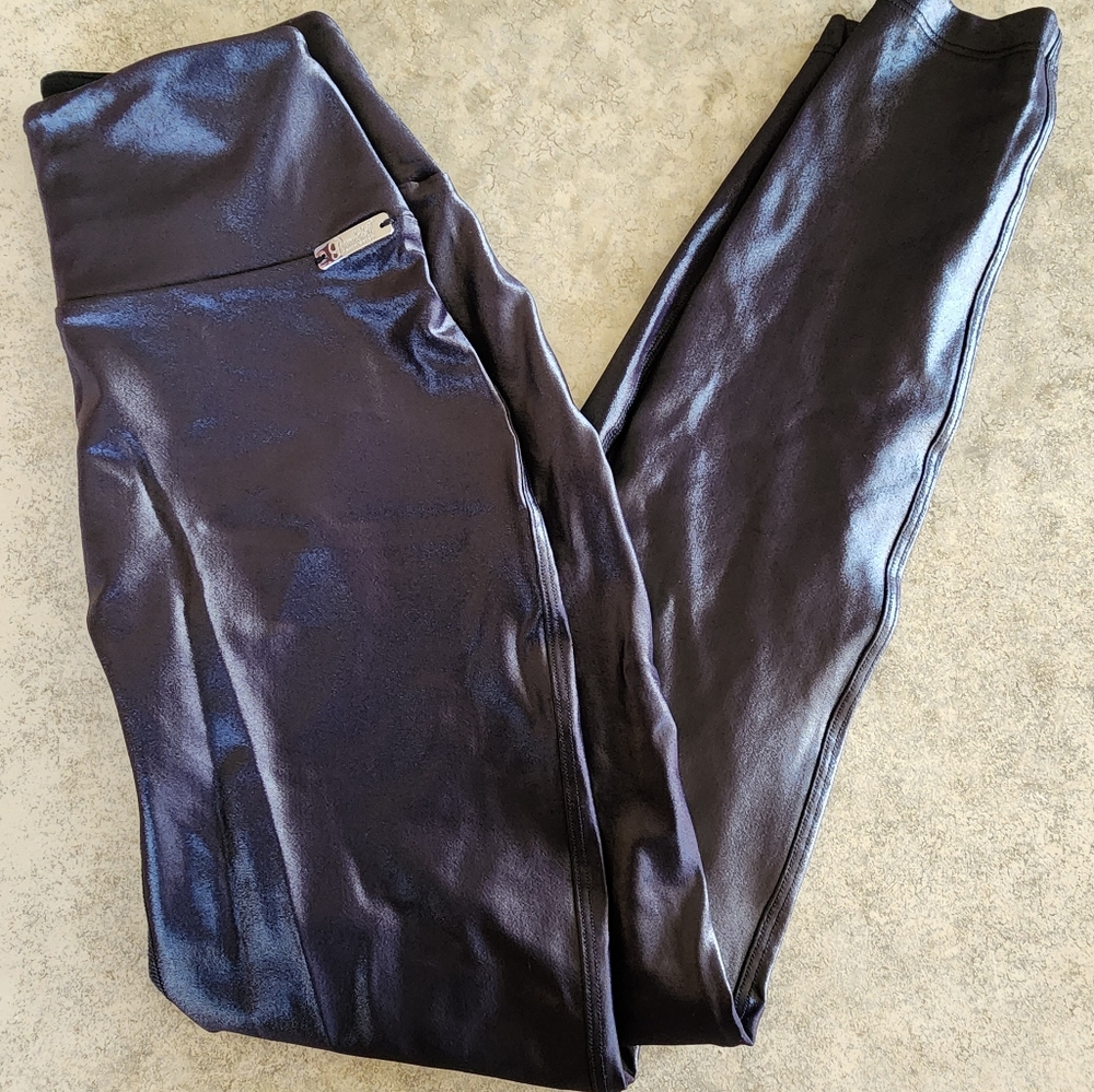 Bombshell sportswear shiny black leggings.